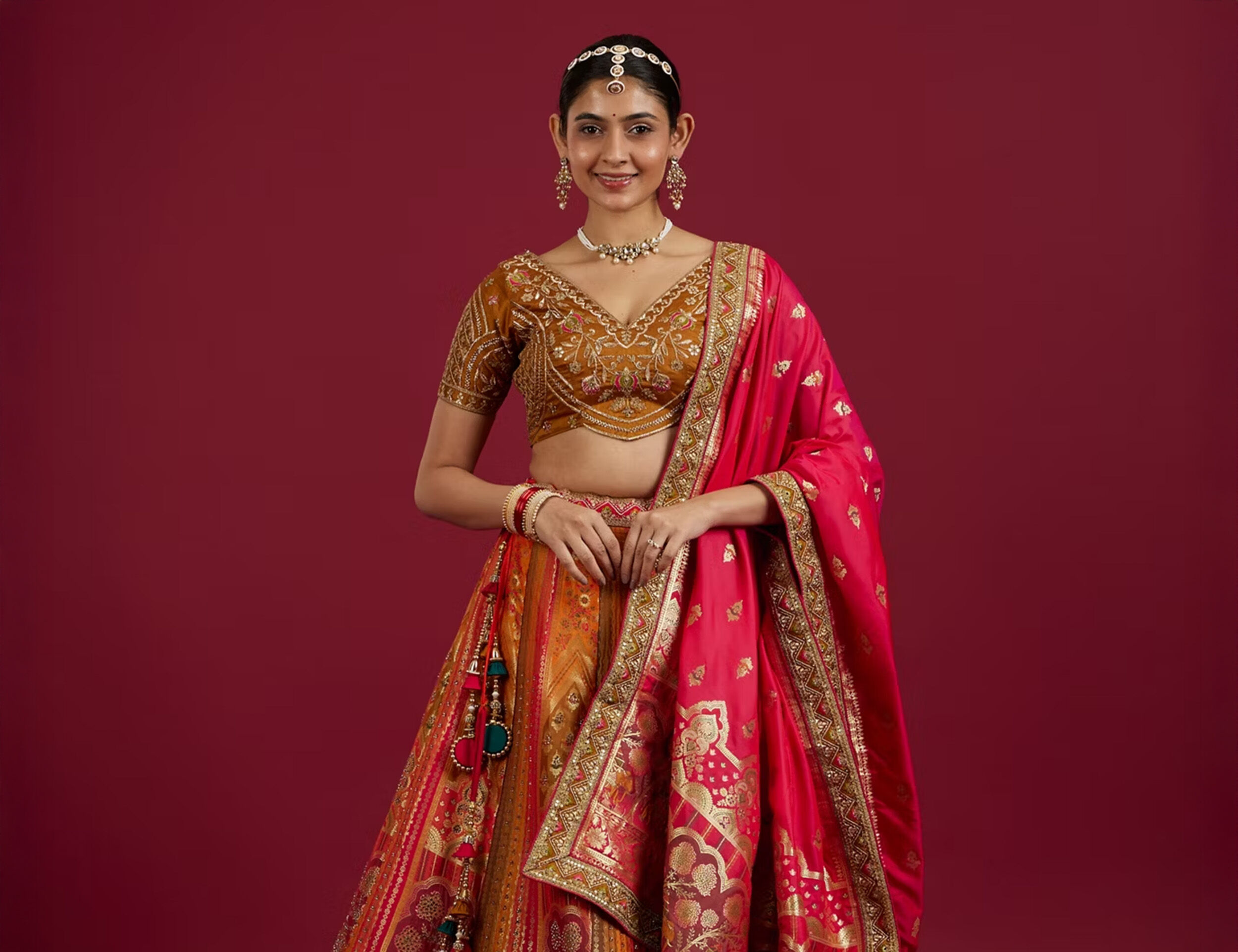 Women wearing Red Zari Embroidered Bridal Lehenga